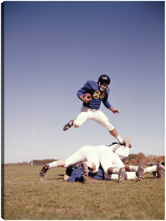 Jugador de fútbol Big Jump - Vintage Images